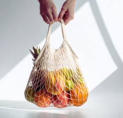 A serene poolside scene featuring a lounge chair and an umbrella beside the sparkling water.