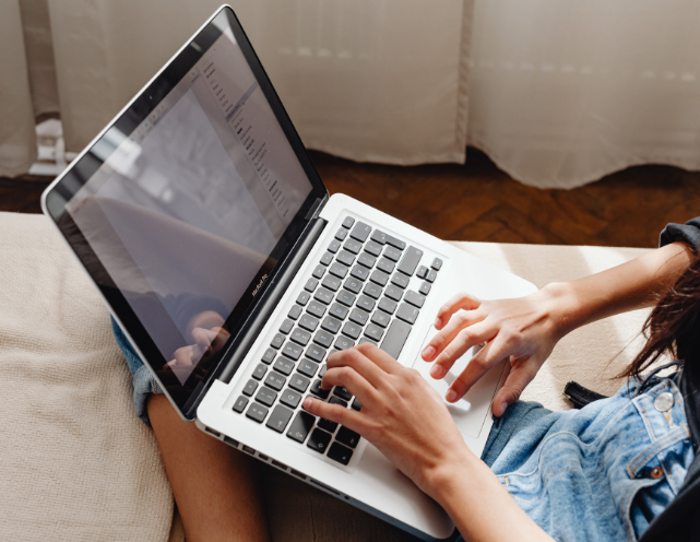 A person is opening the door to a hotel room.